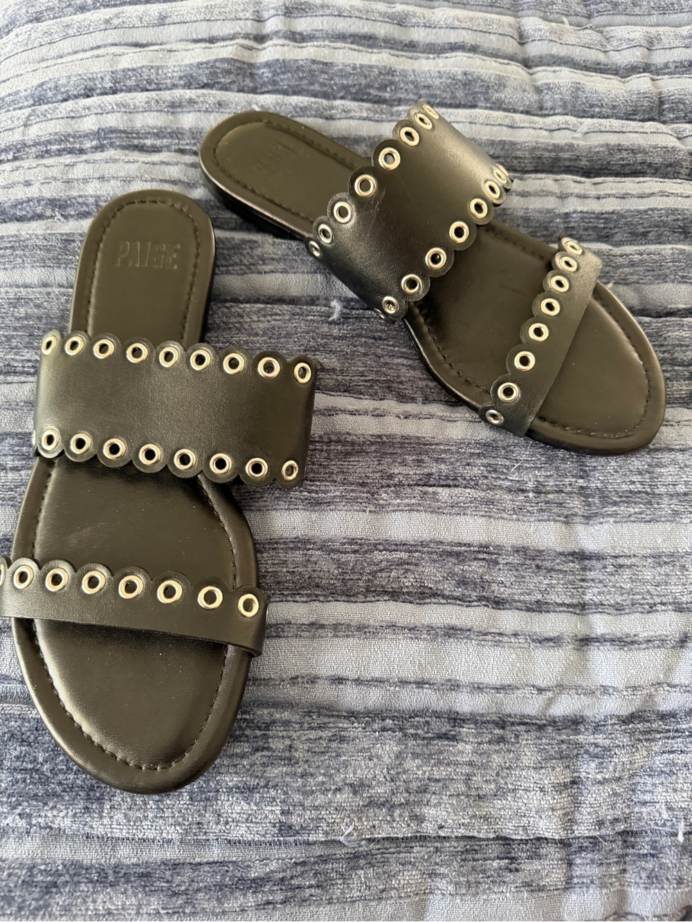 Paige Black Leather and Grommet Flat Sandals in size 7.5